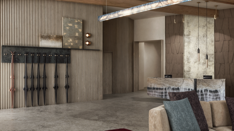 The image shows a modern, stylish lobby with a marble reception desk, decorative lighting, textured walls, and plush seating.